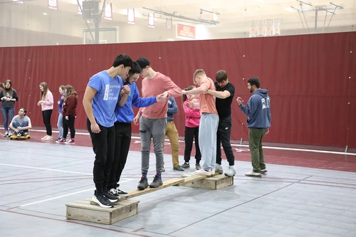 POINT LOOKOUT, MO. — College of the Ozarks, also known as Hard Work U., redefines what it means to receive a college education by dedicating an entire week, called Character Camp, to preparing incoming freshmen for success. Guided by its vision to develop citizens of Christlike character who are well-educated, hardworking, and patriotic, the College ensures new students are equipped to excel academically, build meaningful relationships, and establish a robust support system.   This year, 150 incoming freshmen dove into Character Camp from Jan. 6-12. Character Camp is a cornerstone of the College of the Ozarks experience.  Classes for the spring semester began on Tuesday, Jan. 14. Before classes commenced, students participated in Work Training Day on Jan. 13, preparing them for their on-campus work assignments. New students officially began their journey at College of the Ozarks on Jan. 6, with move-in day.  During Character Camp, students were welcomed into the College of the Ozarks family through a series of intentional activities. They formed connections with peers, familiarized themselves with campus resources, and laid the groundwork for their academic and personal growth. By fostering a sense of belonging, the program ensures students have the support they need to thrive.  Students were organized into 14 groups known as “families,” with each family led by two upperclassmen who embody the character and values that define the college. These “moms and pops” served as mentors, guiding the incoming students through the week and helping them navigate this chapter of their lives.  “Character Camp really impacted me because I had a lot of reservations when I first came in, as I was in a new environment with people I didn’t know,” shared Micah Jacobs, a junior public relations major and Character Camp “mom.” “Character Camp encouraged me to come out of my shell and invest in the opportunities and relationships that were in front of me. I am thankful for the opportunity to now be a Character Camp mom and encourage the same in new incoming students. My favorite activity is the challenge course, as it is one of the first team-building exercises that we do as a family. I get to watch these new students grow in fellowship with one another as they solve difficult problems together.”  The week is packed with activities that emphasize character development, teamwork, and a strong work ethic. Students participate in community service projects such as scrubbing milk equipment at the dairy, tending to the gardens, and deep cleaning the engineering building. These hands-on tasks reflect the College’s commitment to cultivating responsible, service-oriented, and hardworking individuals.
